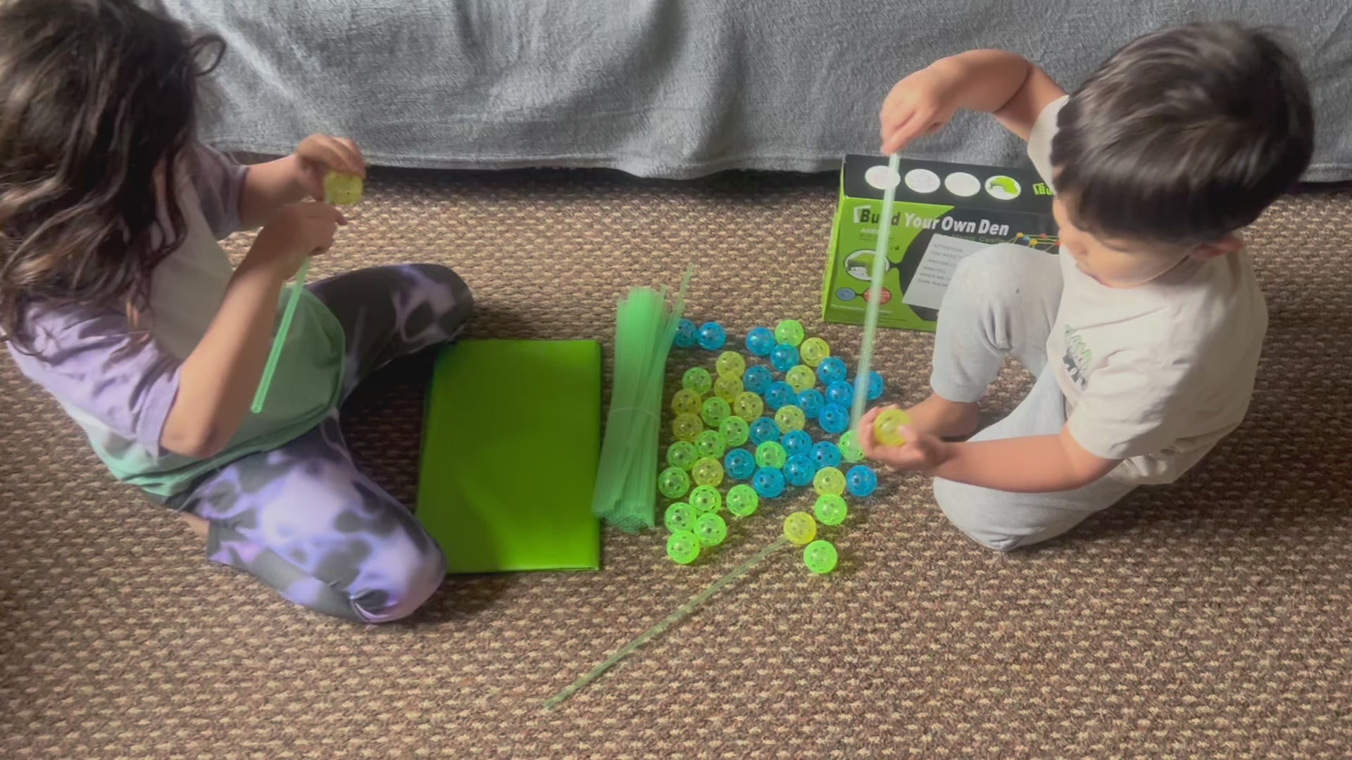 Load video: Children happily building a glow in the dark den